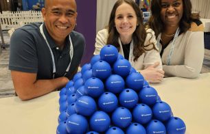 Three HealthSherpa employees at a conference