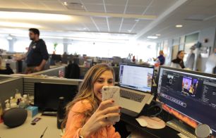 NBCUniversal employee taking a photo in office